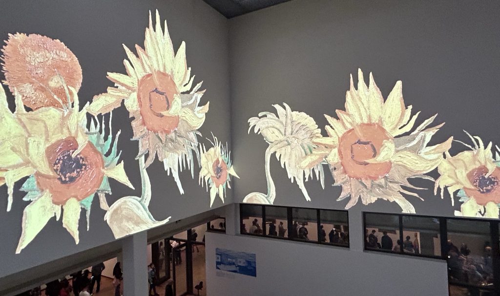 Interior of the Van Gogh Museum with sunflowers projected
