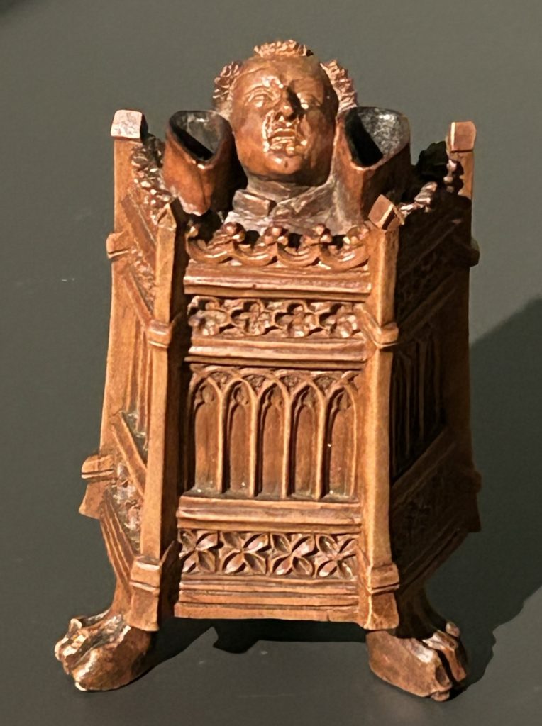 Medieval wood sculpture of monk in pulpit s in the Riiksmuseum in Amsterdam
