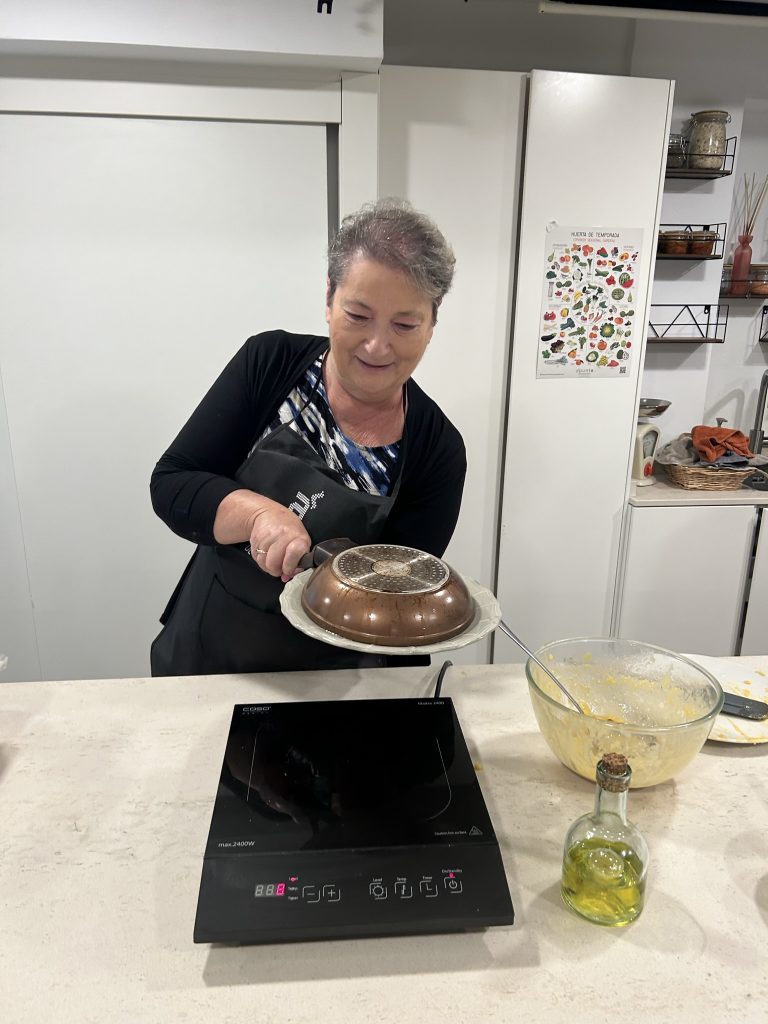 Carol Making atortillas as cooking class