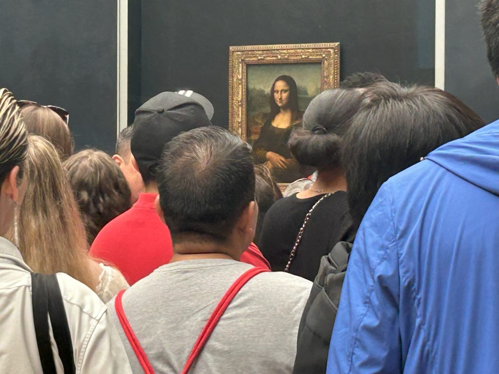 Crowds in front of the Mona Lisa at the Louvre in paris