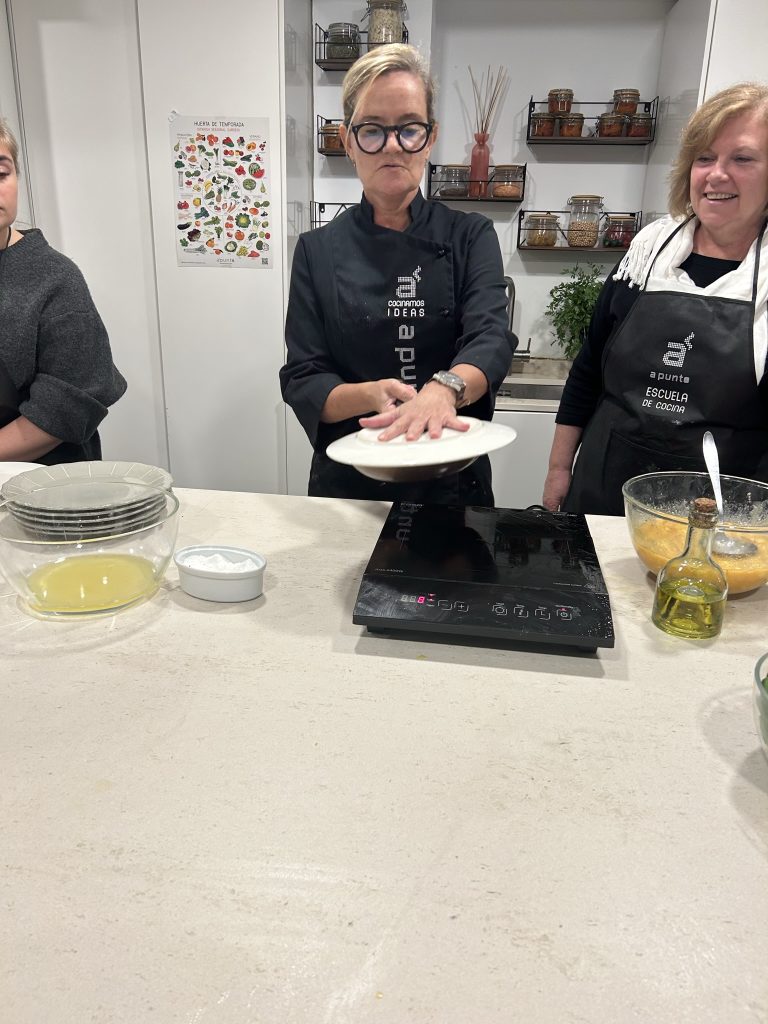 Chef demonstrating in a cooking class in Madrid