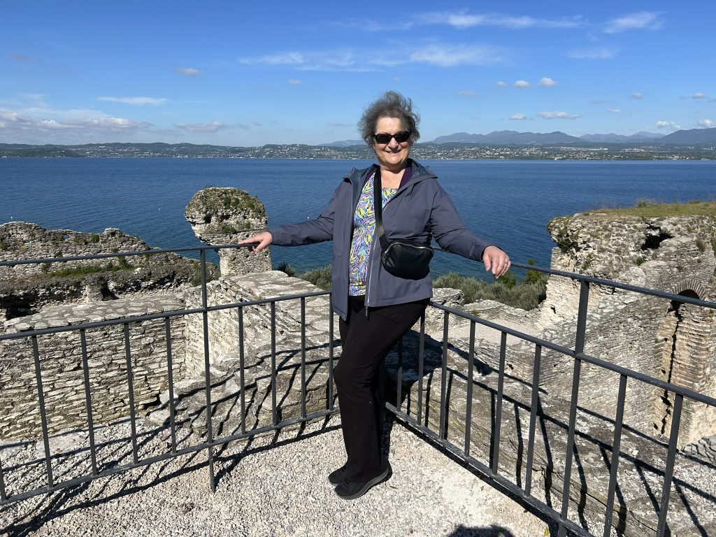 Carol Cram at viewpoint overlooking Lake Garda at the top end of Sirmione