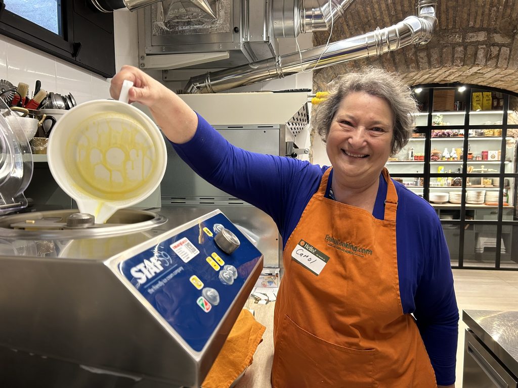 Carol Cram pouring gelato into gelato maker