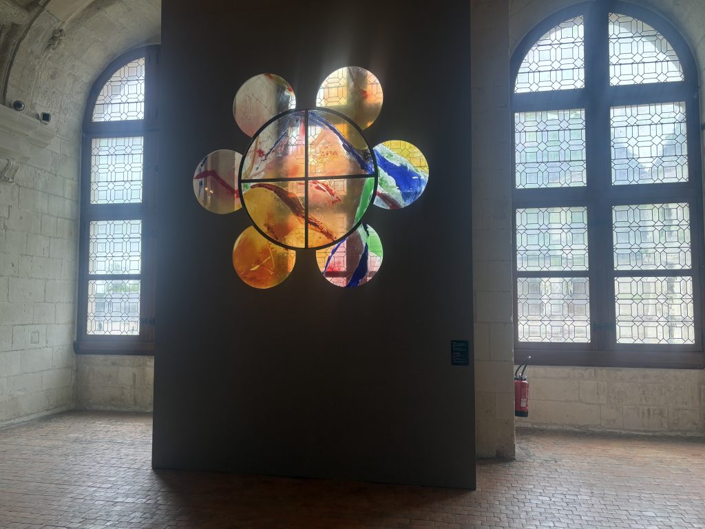 Flower-shaped stained glass window by Korean artist  Kim En Joong featured at Chambord in the Loire Valley.