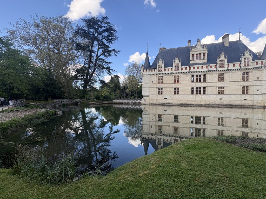 View of Azay-le-Rideau chateau in the Loire Valley perfectly reflected in the formal lake