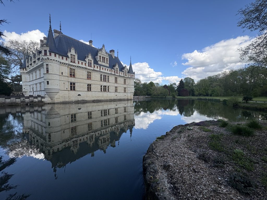 View of Azay-le-Rideau chateau in the Loire Valley perfectly reflected in the formal lake
