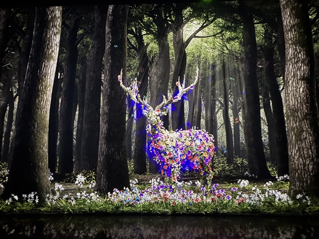 Digitized stag covering in flowers in a forest at the Arte Museum in las Vegas