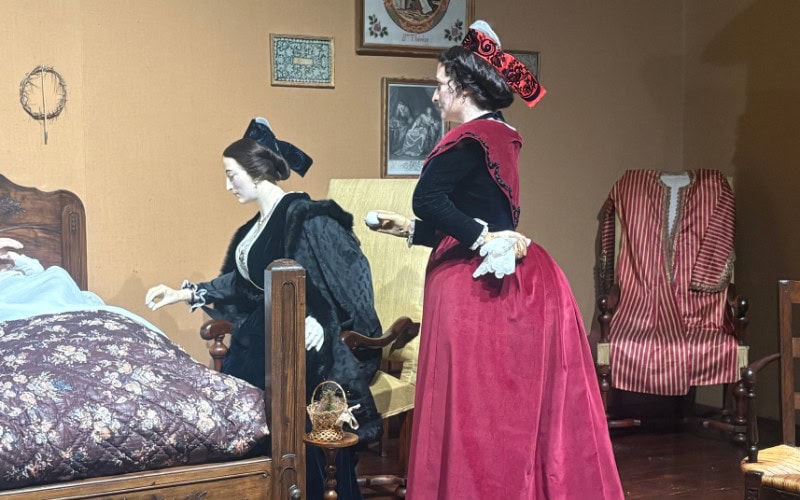 Diorama of women in Arlesieene costumes form the 19th century featured at the Musee Arletan in Arles, France