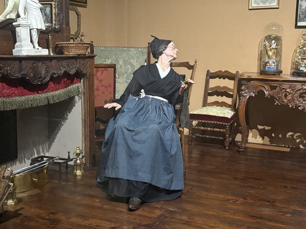 Diorama showing a woman in a rocking chair in  Arles in the 19th century on display at the Museom Arletan, one of three museums in Arles