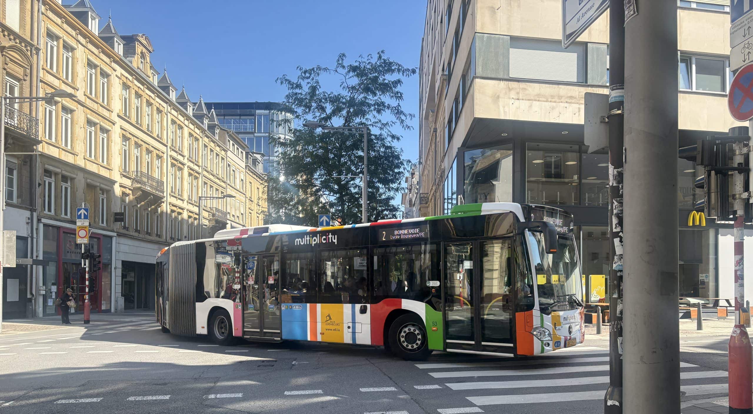 One of many electric busses in Luxembourg city. Busses are brightly painted and are free.