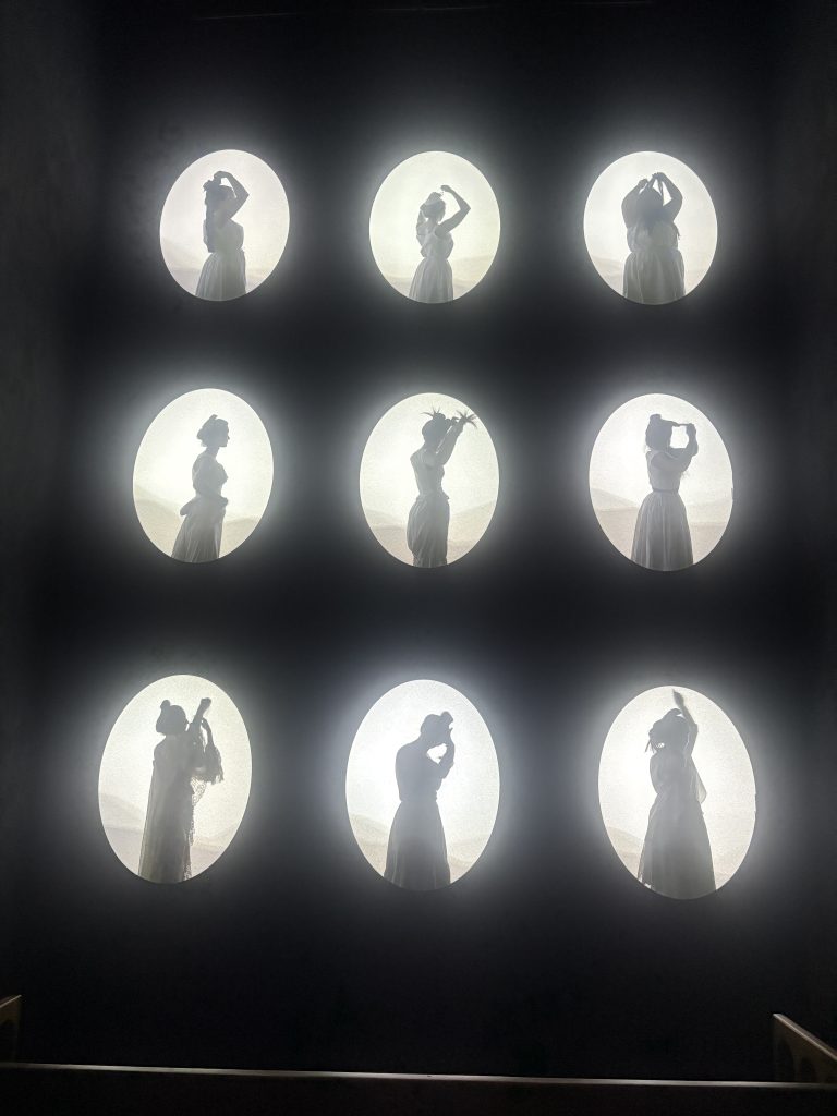 Nine oval views of women dressing in Arlesieene costume  on display at the Musée de la Mode et du Costume 