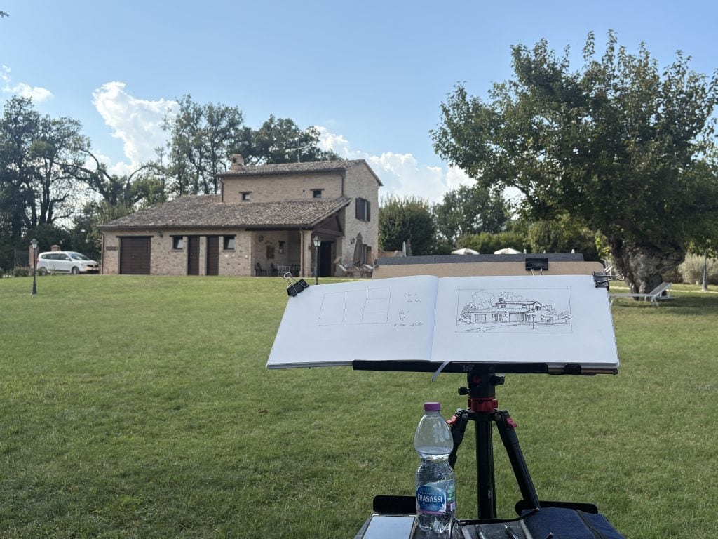Sketch made by instructor Rod Moore showing the house he sketches in the background and the sketch in the foreground