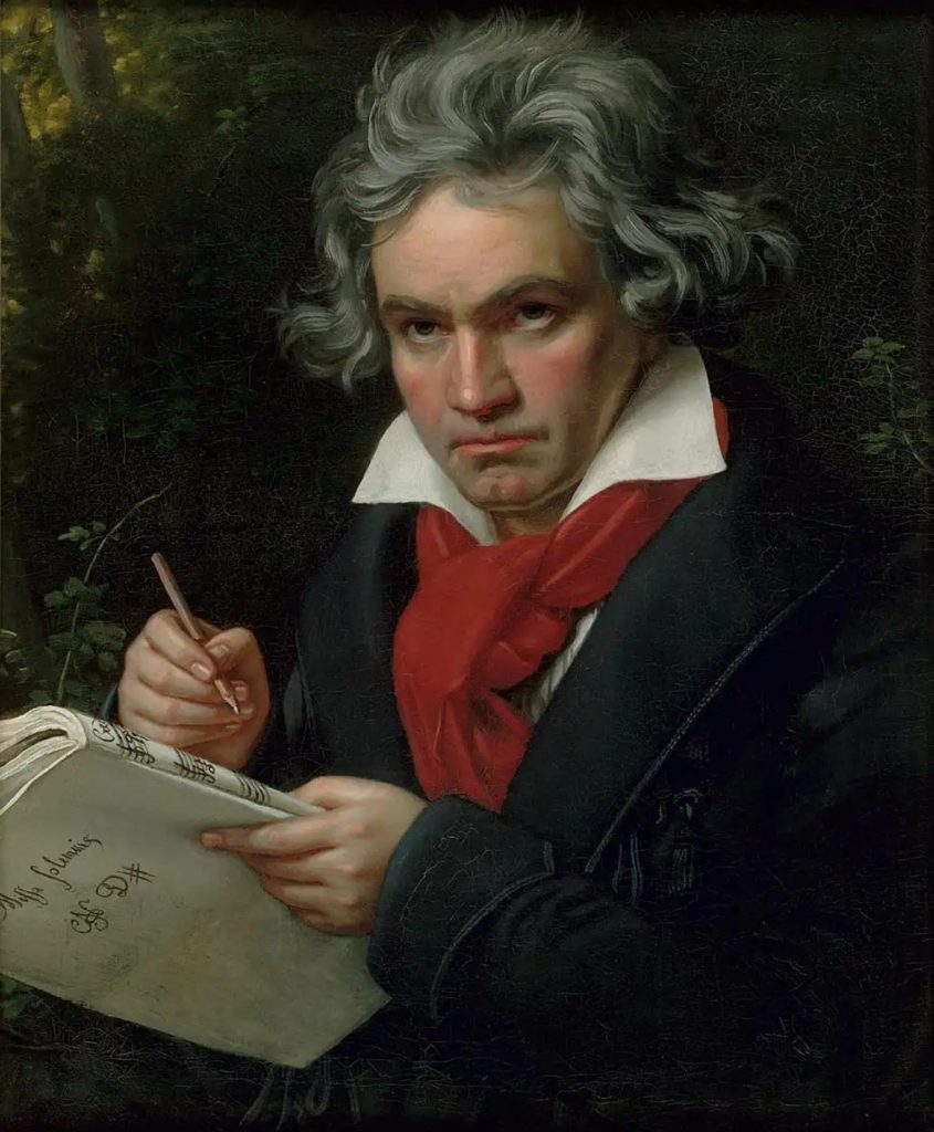 Famous portrait of Ludwig van Beethoven by Joseph Stieler showing the Maestro towards the end of his career. He is holding a pen as if he is about to compose. 