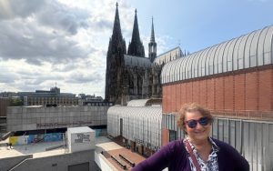 Carol Cram at Museum Ludwig with Cologne Cathedral in the background