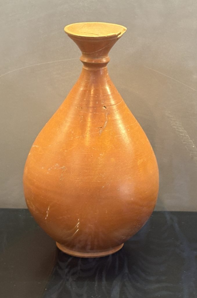 Beatufiully preserved orange urn on display at the Musée Départemental Arles Antique (Museum of Ancient Arles and Provence)
