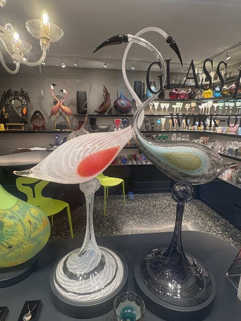 Elegant, large glass flamingos at a shop in Murano