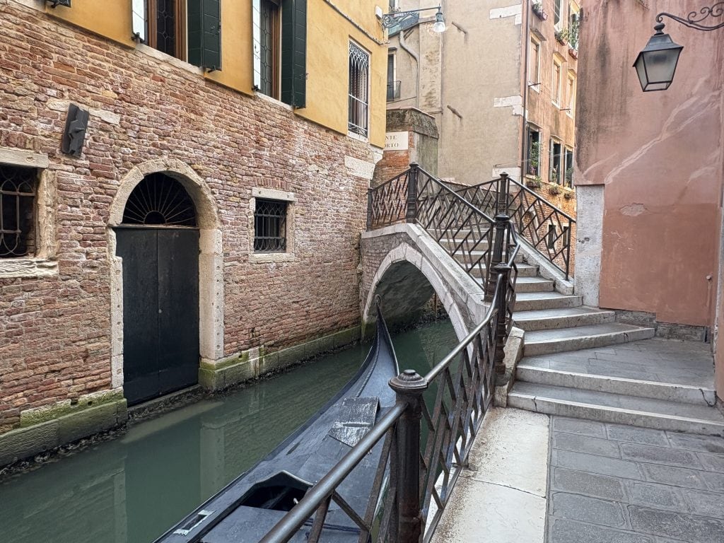 Closeup of bridge and tranquil canal in Venice