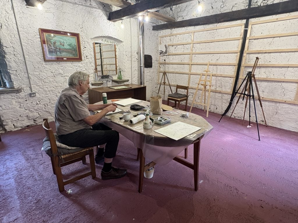 Gregg Simpon working in the art barn at Casale di Clio, an art and writing retreat in Tuscany