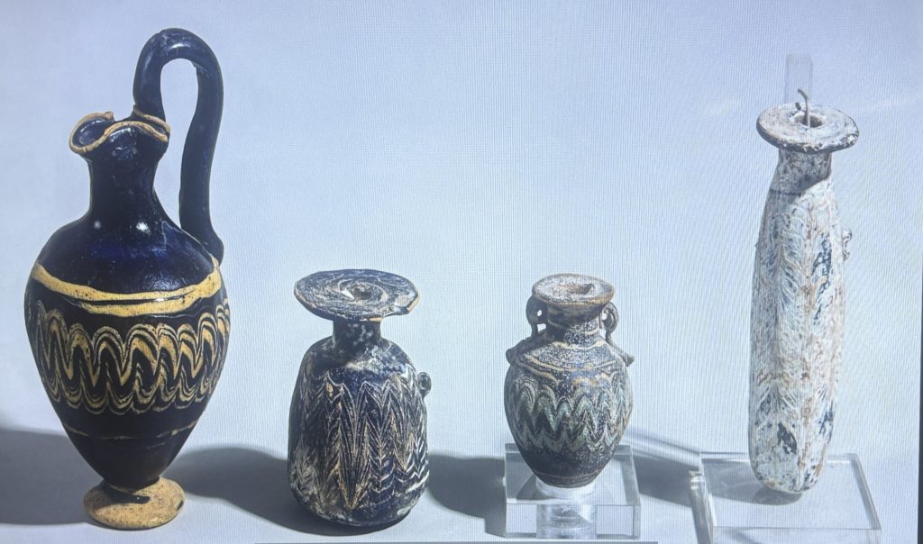 Four ancient glass vessels dating from Roman times displayed at the Farnese civic museum in Piacenza
