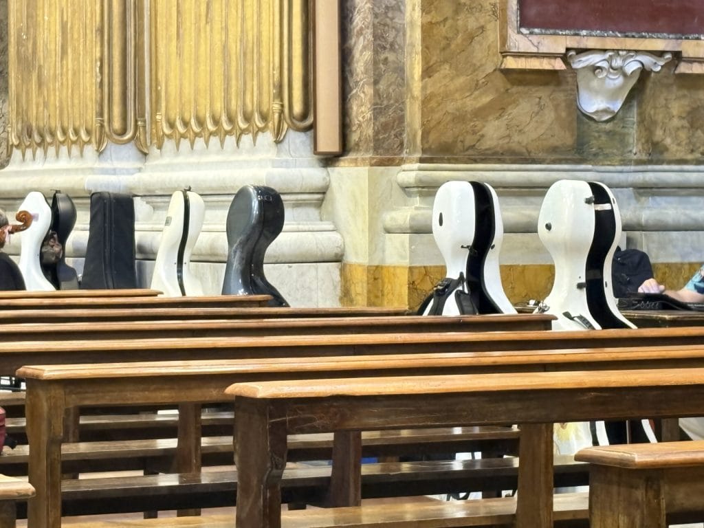A line up of chello cases at a Roman church  taken  on a Rome Photography Tour with Rome Photo Fun Tours.
