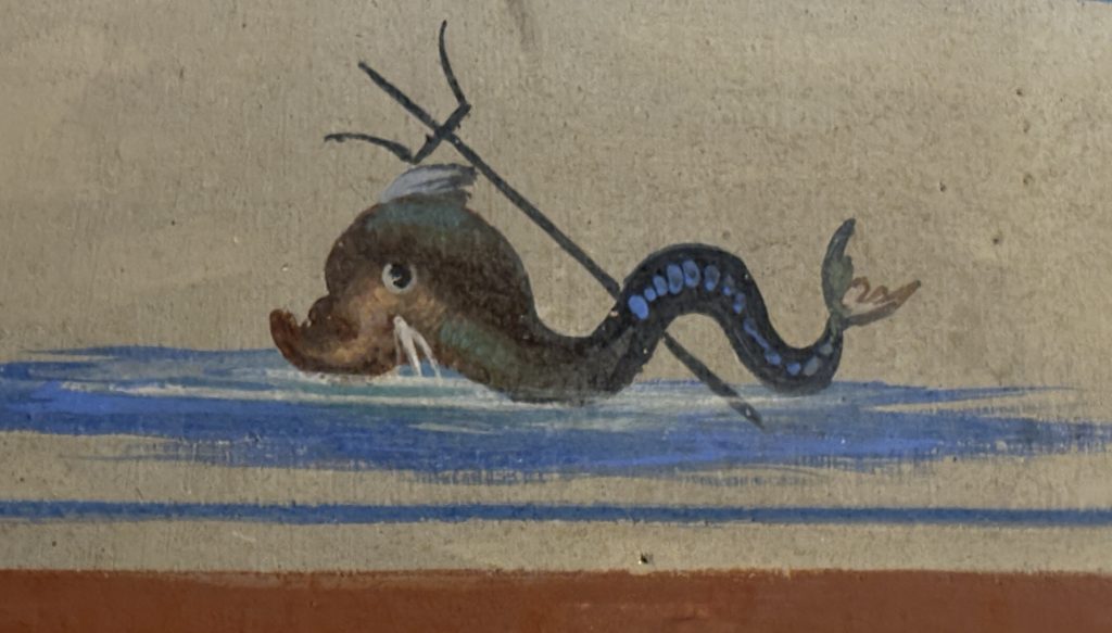 Close up of a detail of a sea serpent painting on a Roman-style fresco in Santimissimi Apostoli in Rome  taken  on a Rome Photography Tour with Rome Photo Fun Tours.