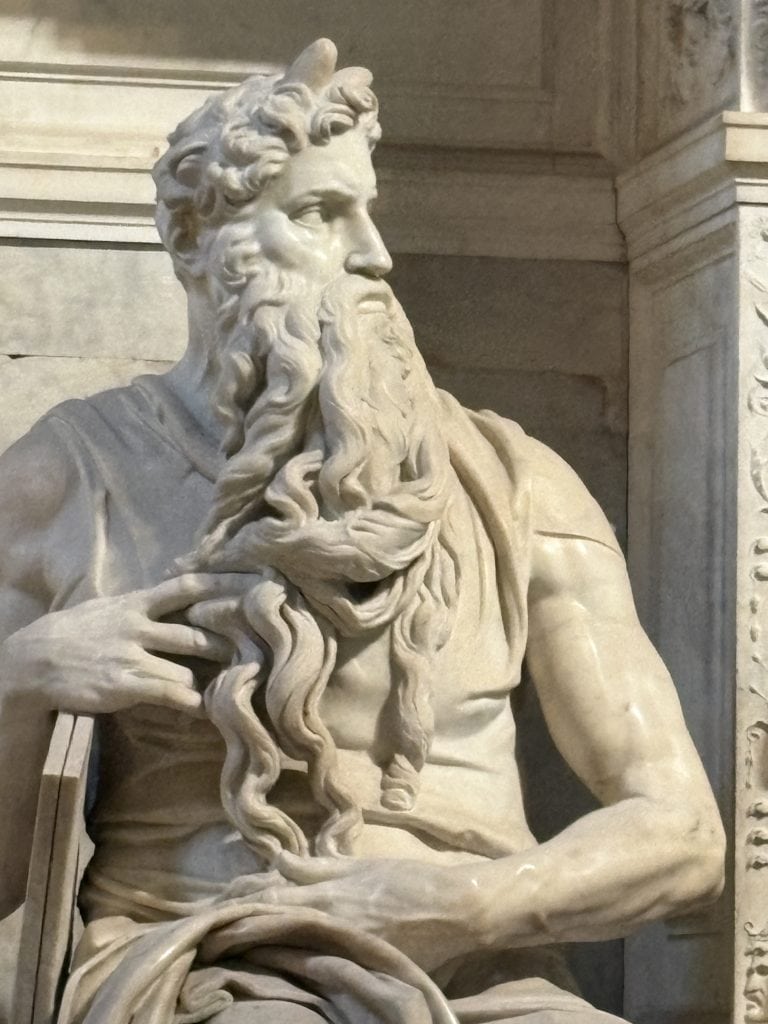 Close up of the head of Michelangelo's Moses statue in the Church of San Pietro in Vincoli taken  on a Rome Photography Tour with Rome Photo Fun Tours.