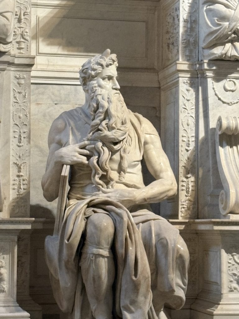 View of the head and torso of Michelangelo's Moses statue in the Church of San Pietro in Vincoli taken  on a Rome Photography Tour with Rome Photo Fun Tours.