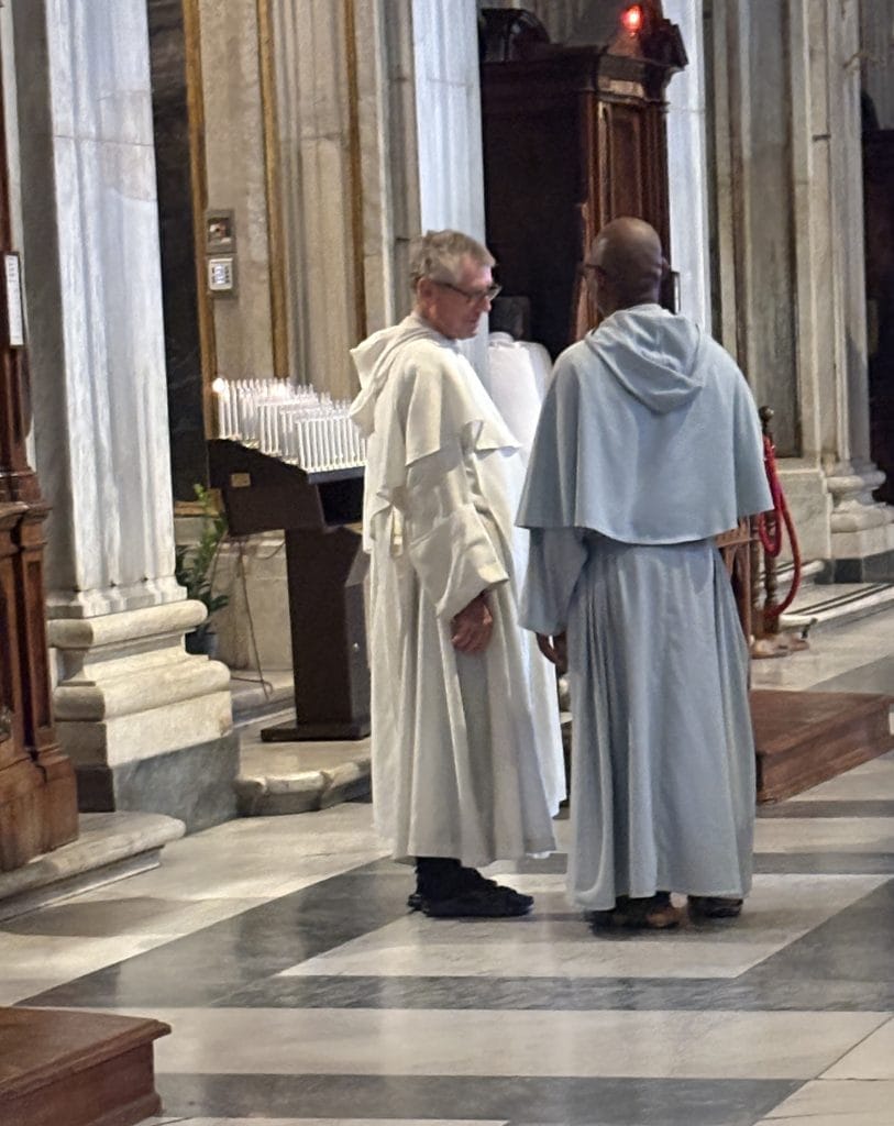Two priests talking in santa Maria Maggiore taken  on a Photography Tour in Rome with Rome Photo Fun Tours.