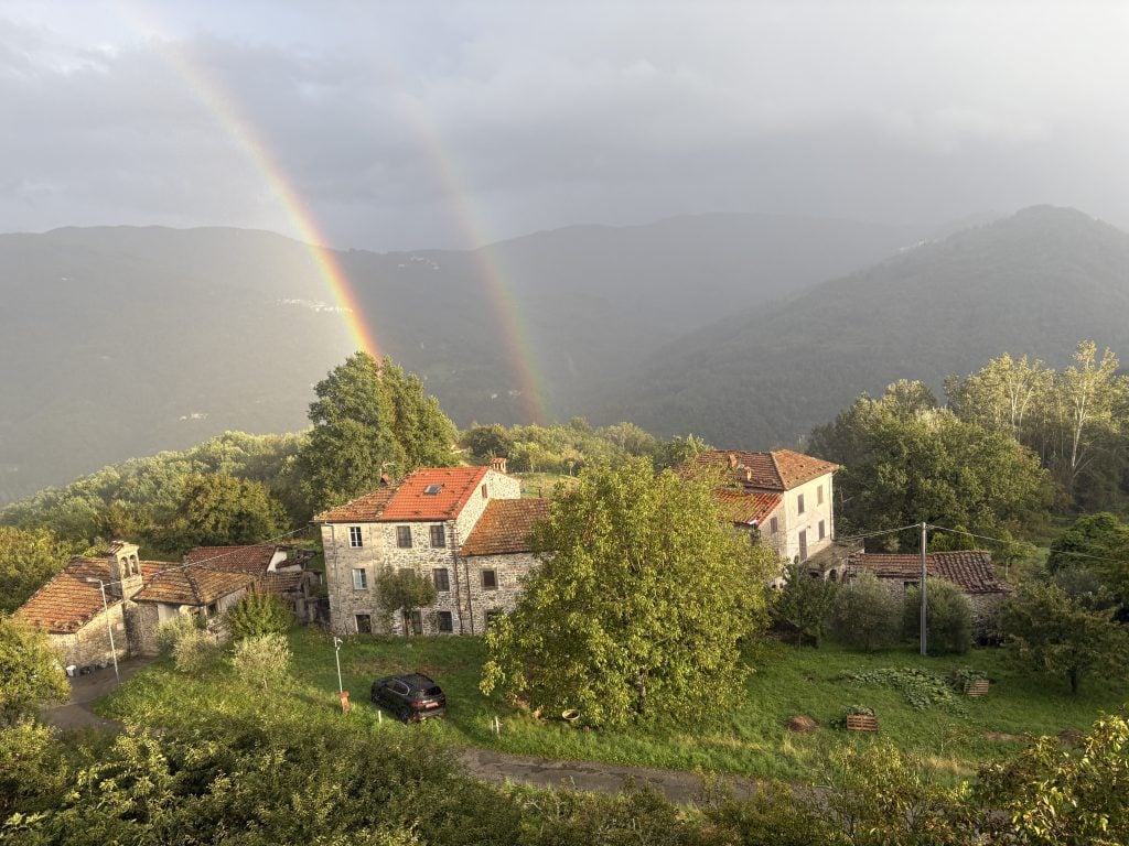 Rainbow over the valey seen from a window at Casale di Clio, a writing retreat in Tuscany