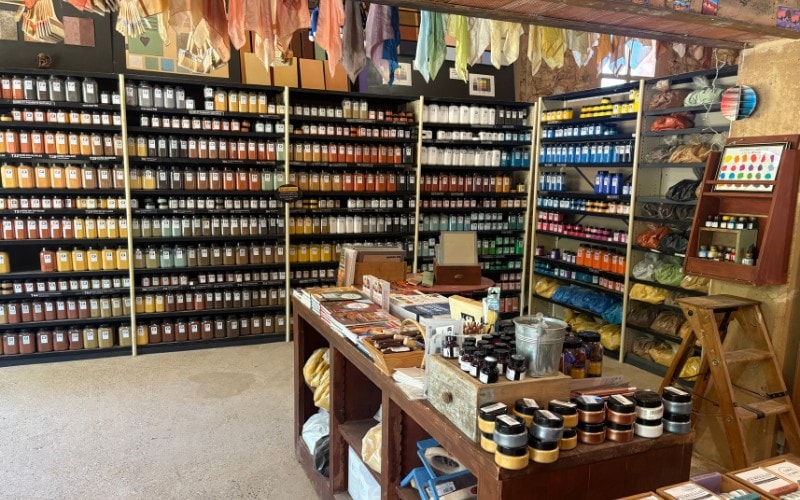 Colorful shelves of art supplies at the ochre museum in Roussillon