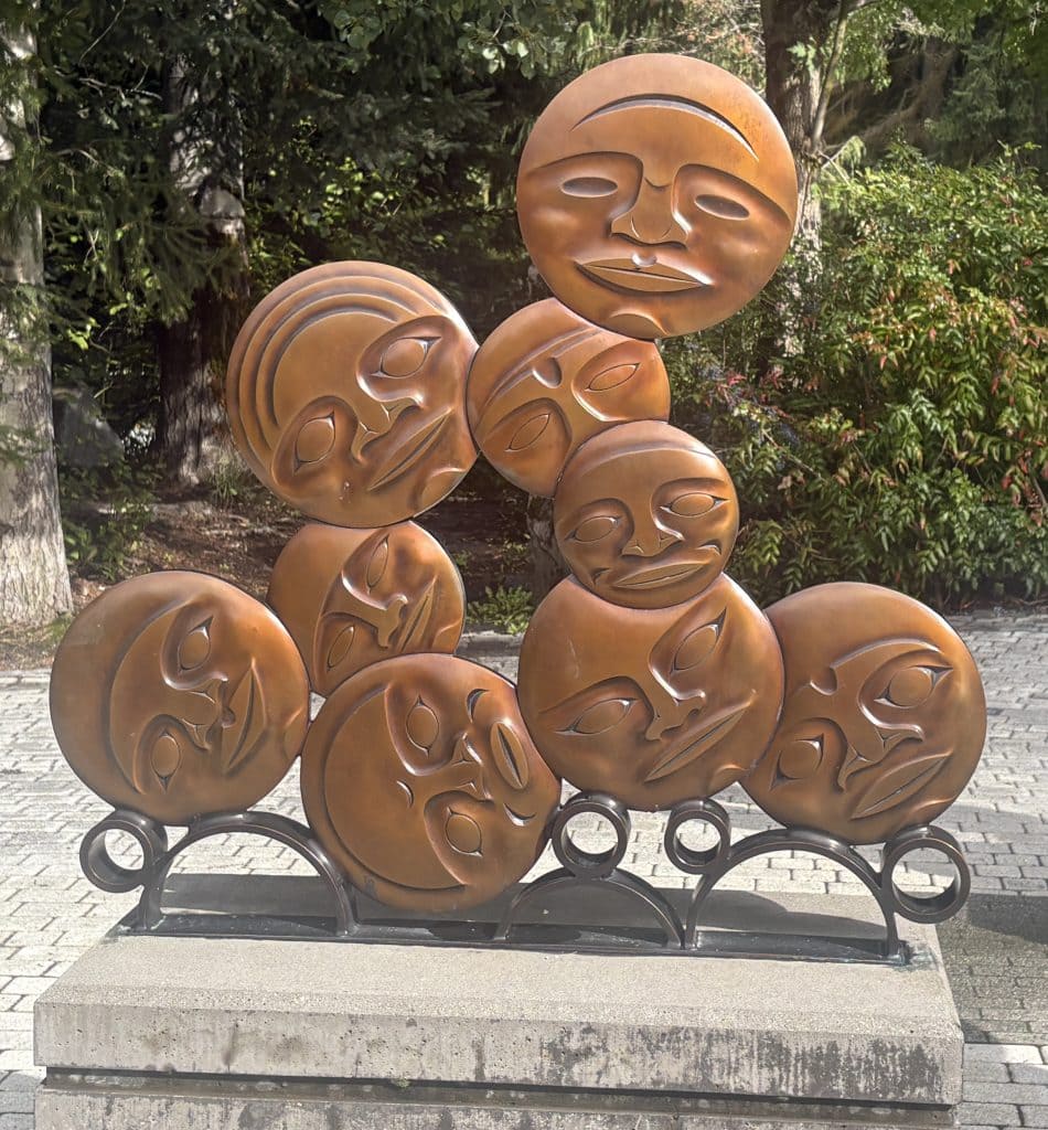 First Nations metal discs showing faces in Whistler, British Columbia