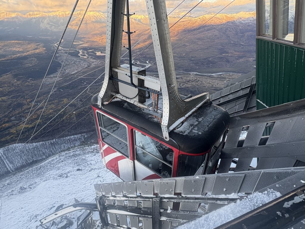 Jasper Sky Tram docking at the top of the mountain with a view of the valley and Jasper in the background.