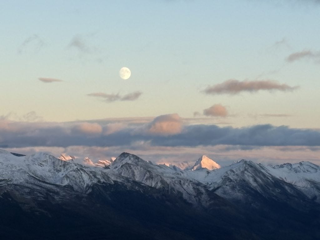 The moon rising over paks surrounding Jasper taken at the top of the Jasper SkyTram