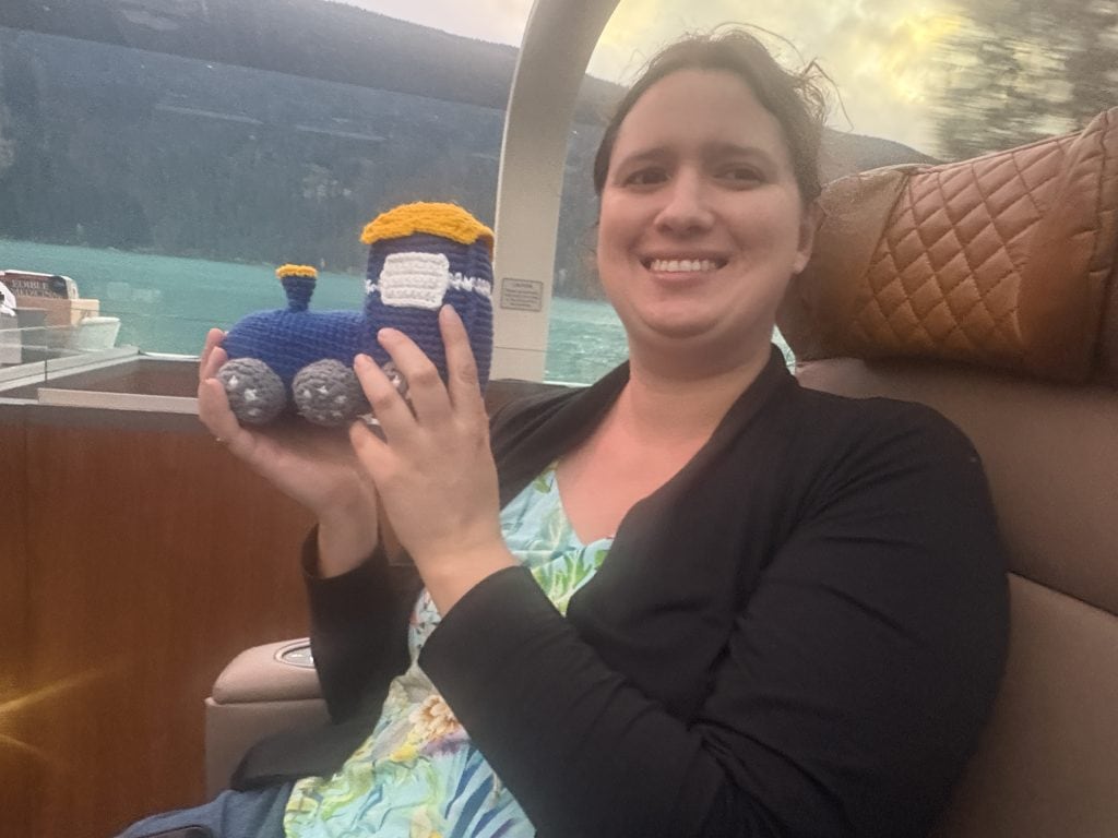 Julia Simpson holding her crouched train on the Rocky Mountaineer