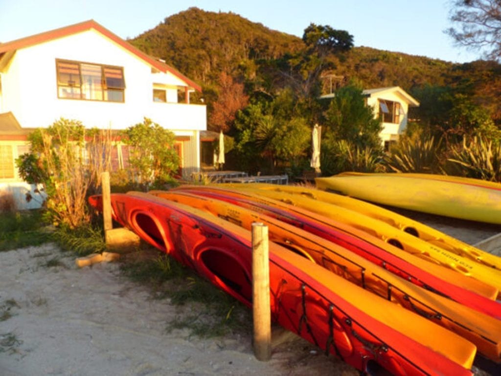 Kayaks on the beach in Abel Tasman National Park in New Zealand