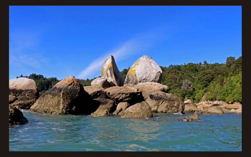 Split Apple rock in Abel Tasman National Park in New Zealand seen from the boat