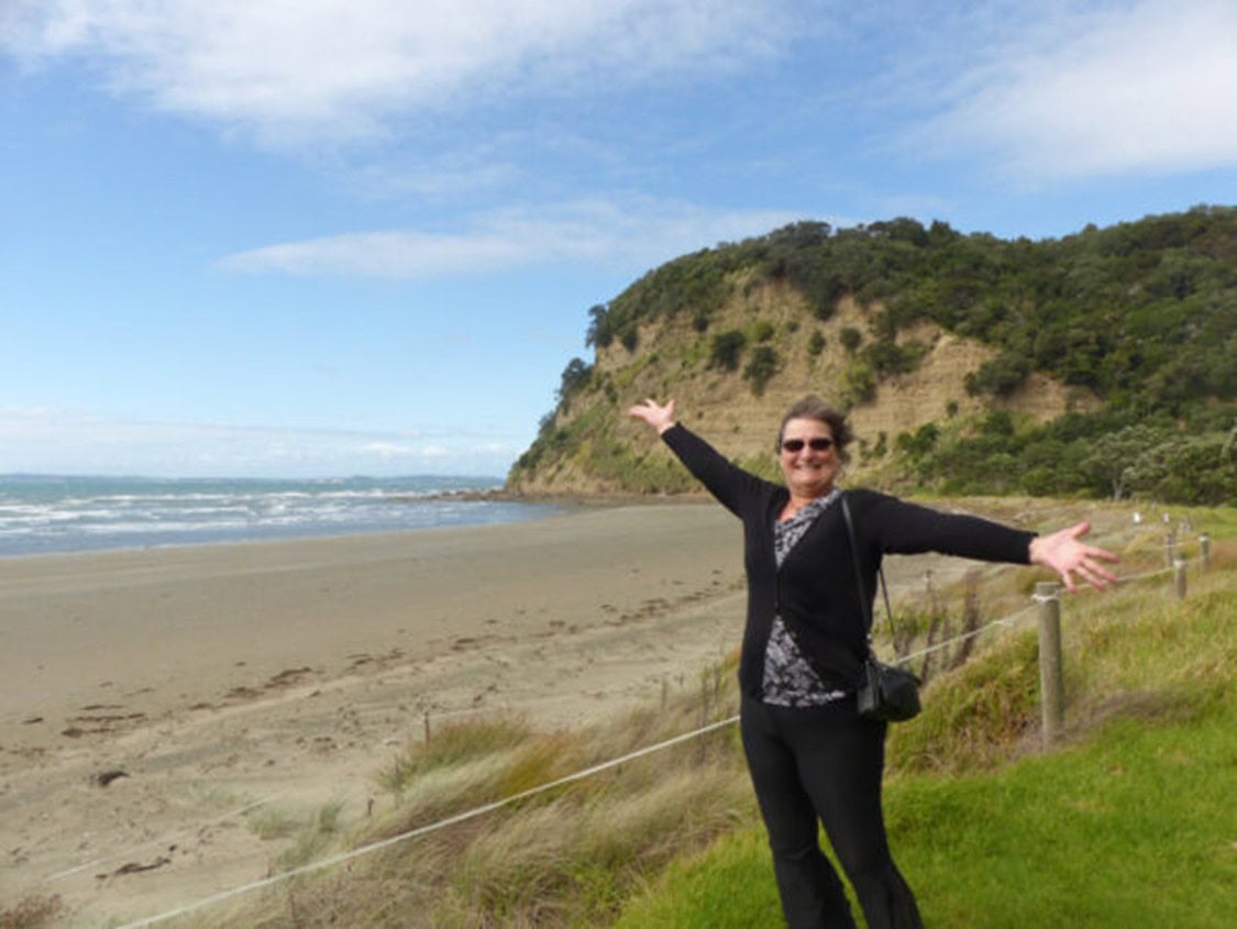 Carol on the beach near Wenderholm Park on the north island of New Zealand