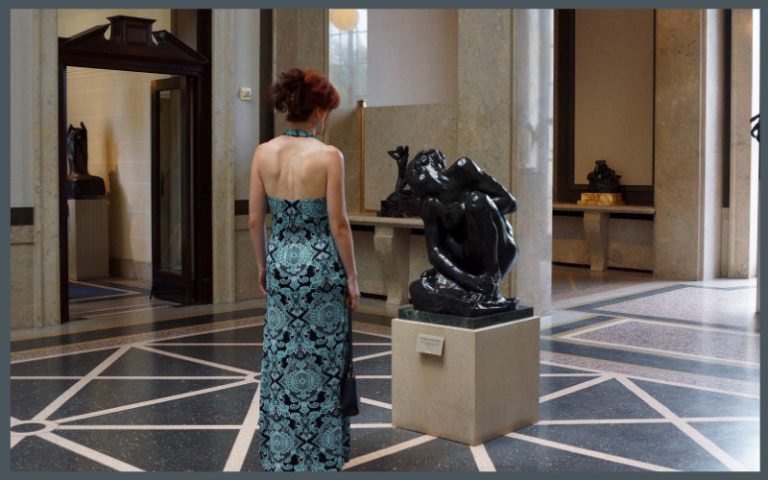 Woman looking at a sculpture in the Musee Rodin in Paris
