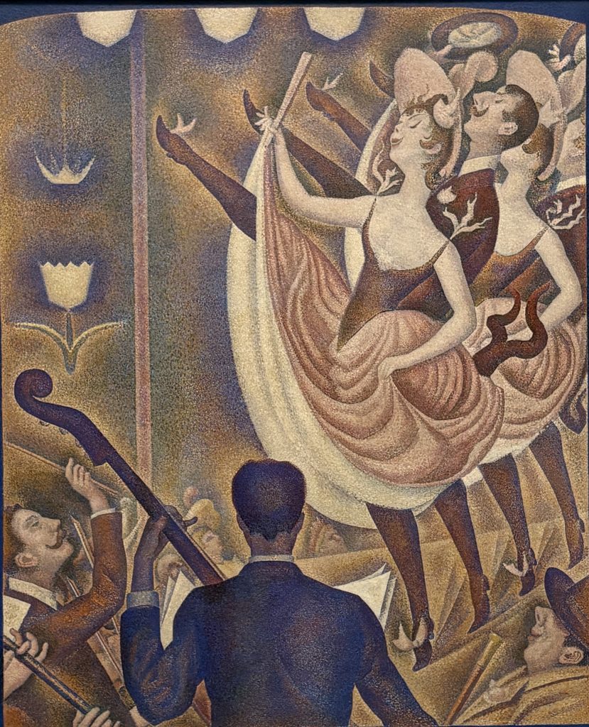 Georges Seurat's Le Chahut, a pointillist painting of can-can dancers kicking on stage with a bass player and conductor in the foreground