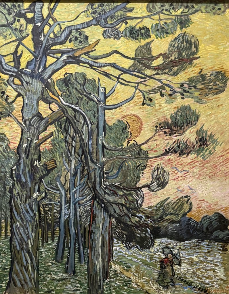 Van Gogh painting of contorted pine trees against a yellow sunset sky with a small figure holding an umbrella